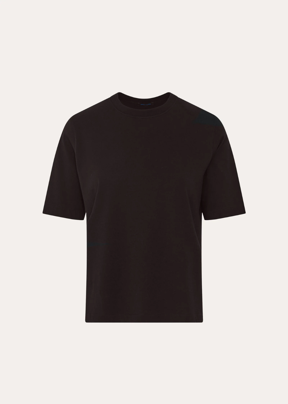A plain black short-sleeve crewneck t-shirt displayed against a light off-white background.